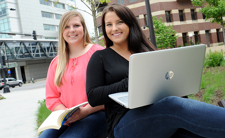 Two DMACC Students Sitting Outside