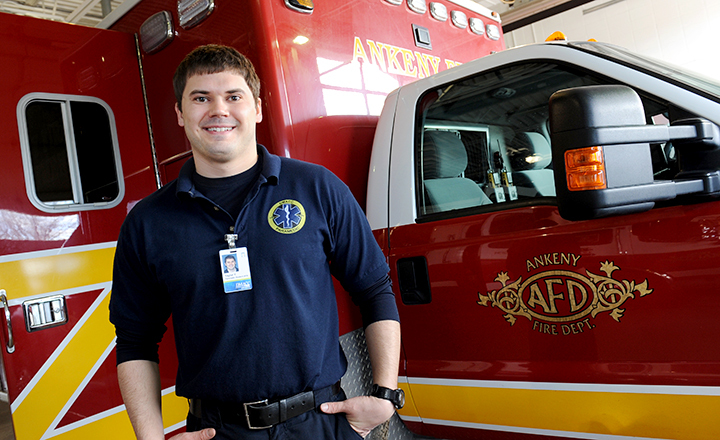 DMACC EMT Student Standing in Front of Ambulance