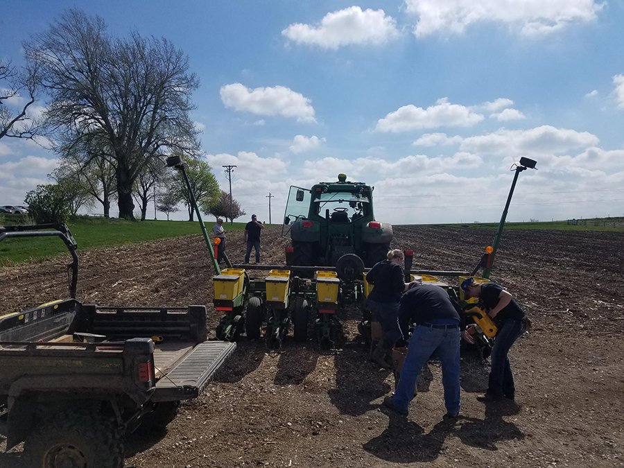 Students gaining experience planting. 