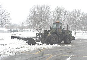 Snow being removed from parking lot