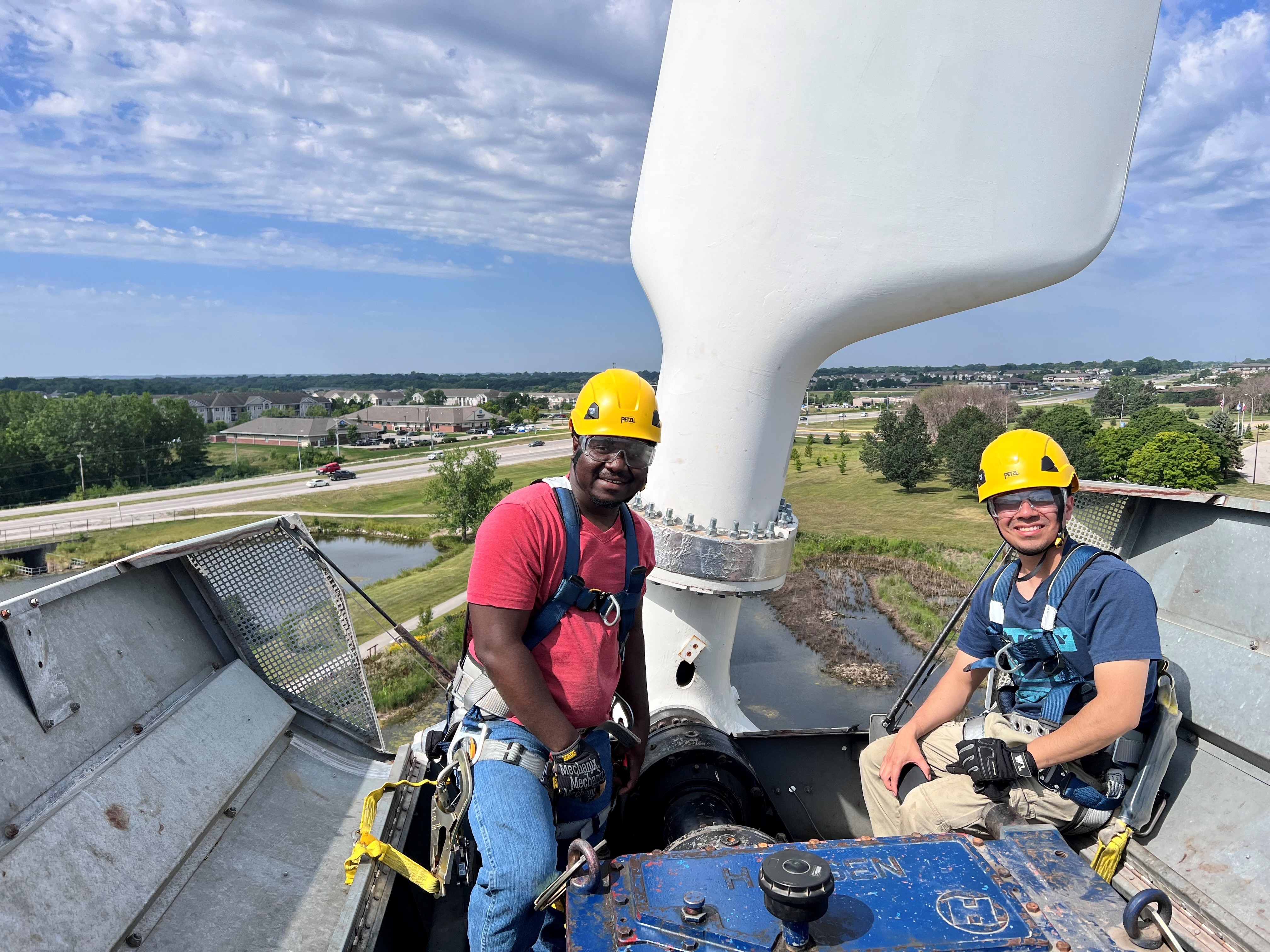 DMACC Wind Turbine with students training (courtesy of DMACC).jpeg