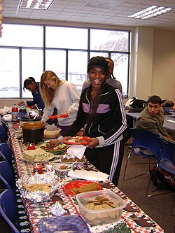 Student getting food at table