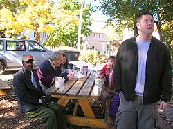 People sitting around a picnic table