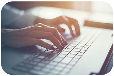 hands on a computer keyboard