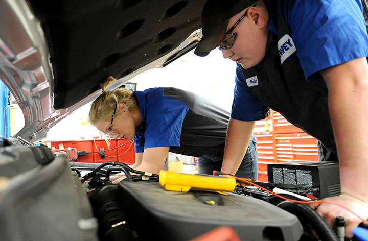 DMACC Ford ASSET students working under car