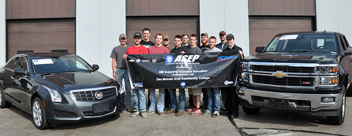 DMACC Automotive Students with one of the donated cars from General Motors